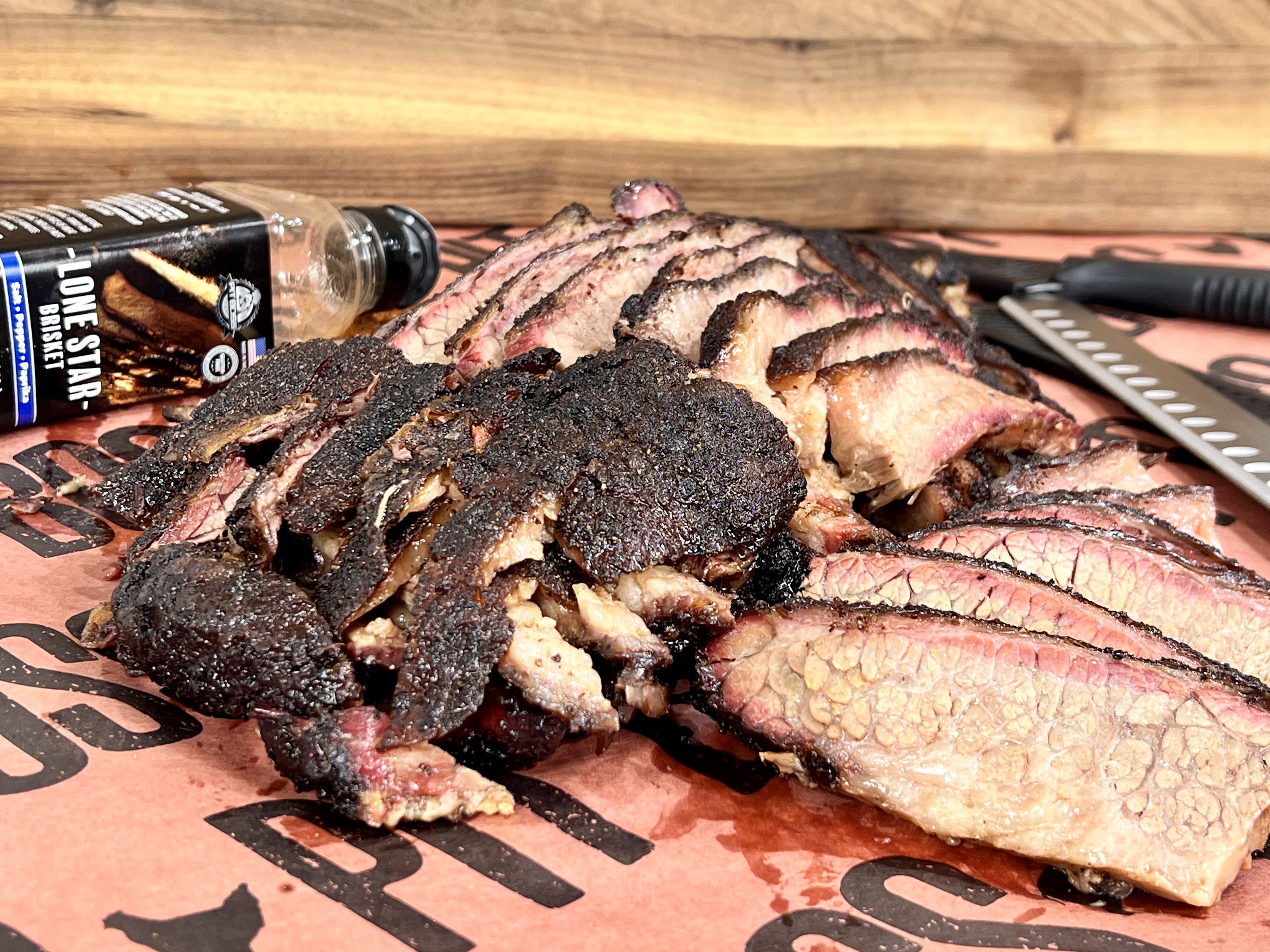 cooked brisket sitting on butcher paper