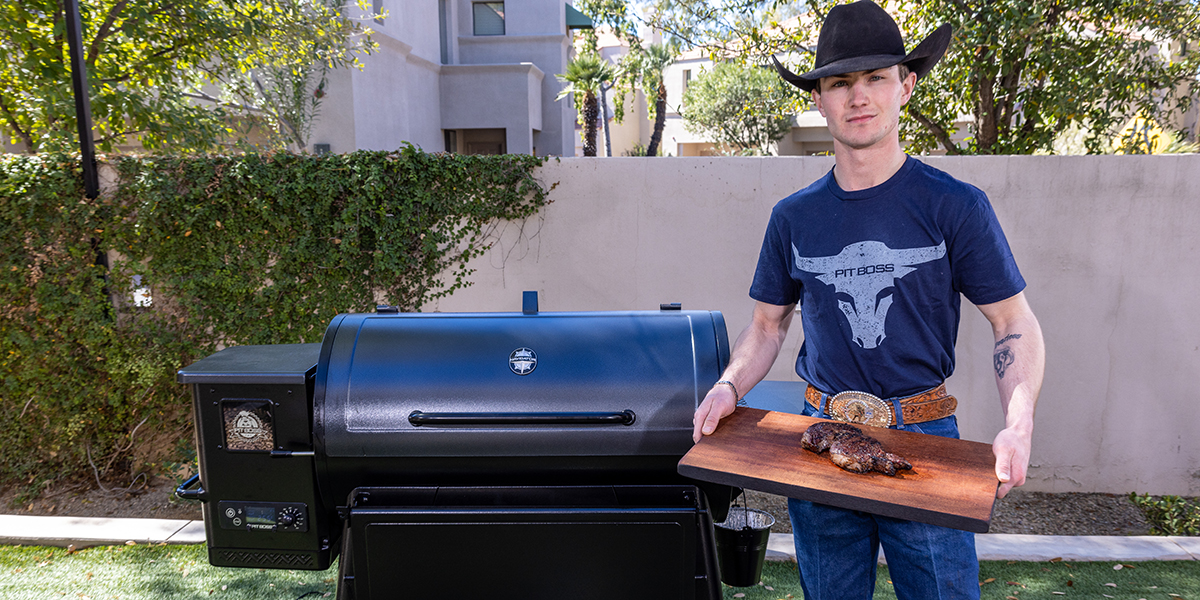 Jess Lockwood standing next to his Pit boss Navigator grill