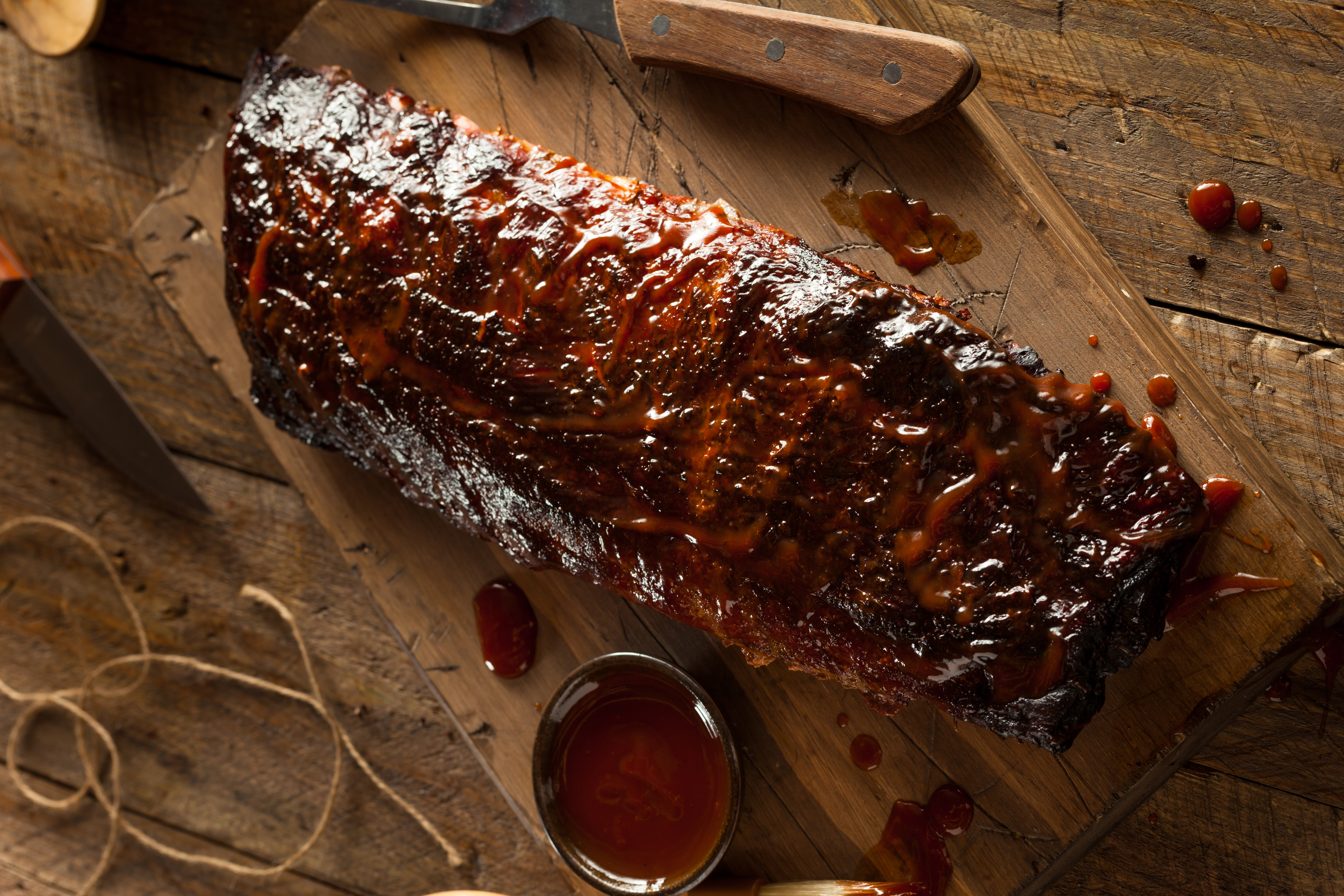 Smoked Ribs with Sauce on wood cutting board